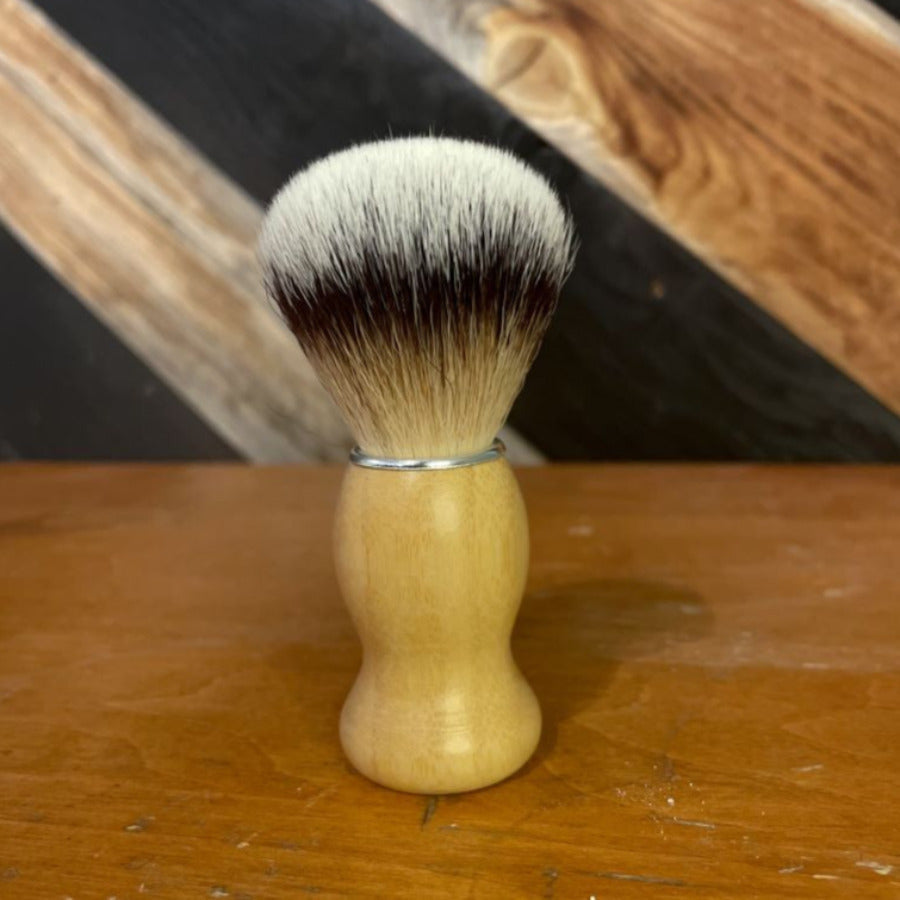 OTB Refills vegan beech wood and nylon shaving brush with natural bristle detailing for a smooth shave.