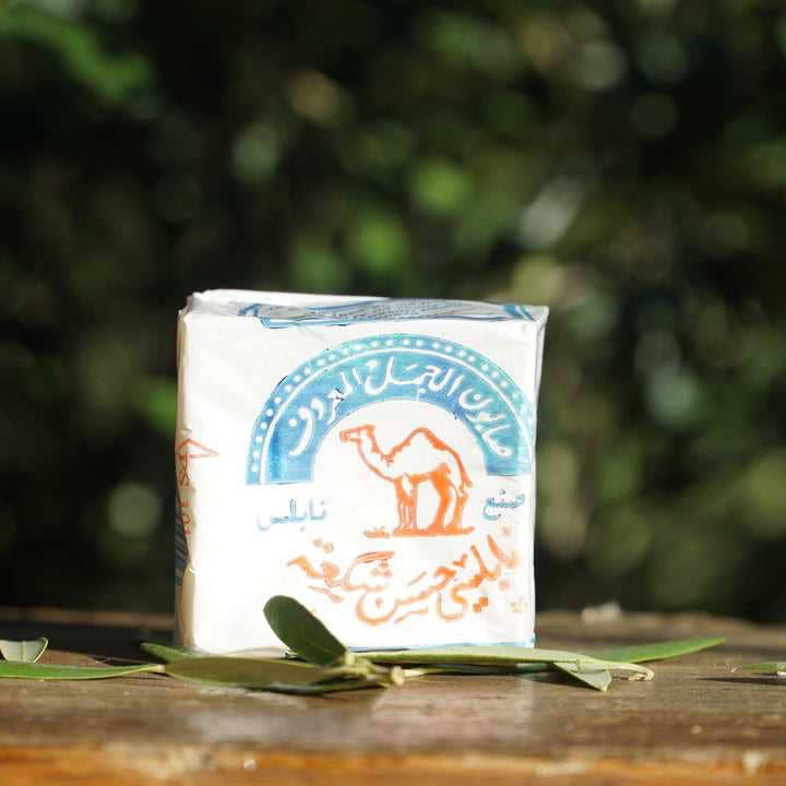 Nablus Olive Oil Bar Soap by Palestinian Soap Cooperative Inc, creamy soap with natural olive oil texture, rectangular shape, and label.