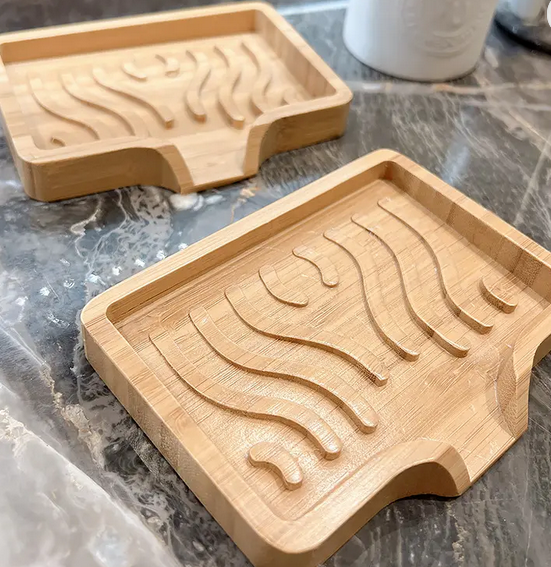 Bamboo water fountain soap dish featuring a lotus wood design by OTB Refills, with flowing waterfall water feature.