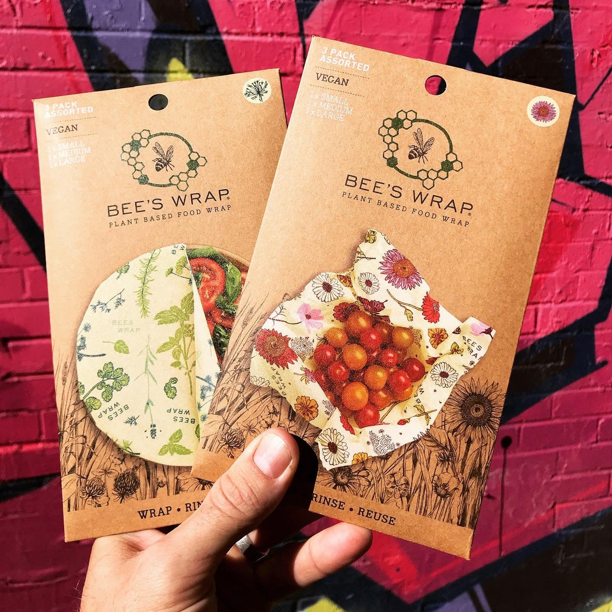 Set of three Bee's Wraps vegan reusable food wraps in various sizes, made from eco-friendly, washable fabric for food storage.