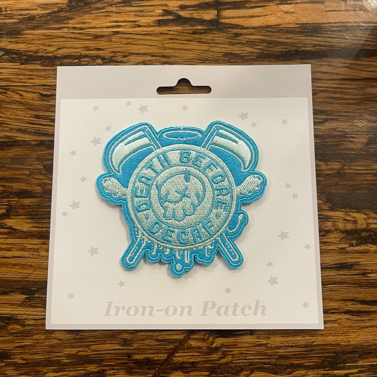 Darling Homebody Death Before Decaf patch featuring bold black text on a white fabric patch.