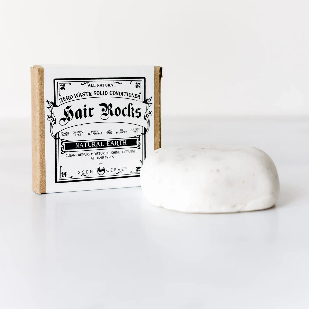 ScentCerae Hair Rocks natural shampoo bar with textured surface and earthy packaging, designed for gentle hair cleansing.