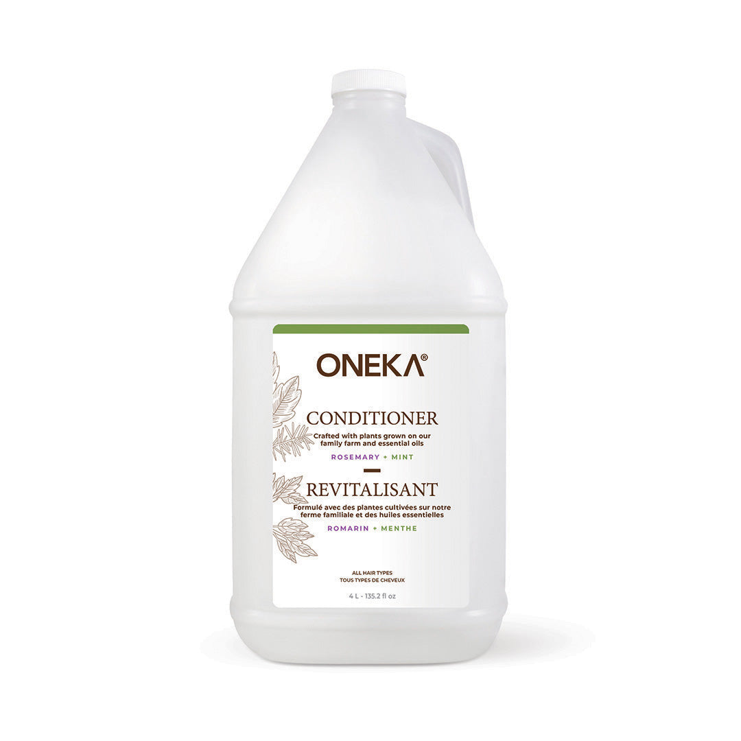 Oneka RMOC Rosemary Mint Conditioner refill bottle with fresh rosemary and mint ingredients, shown in a natural setting.