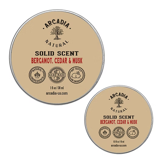 Natural Solid Scents perfume by Arcadia Naturals, showing the sleek, minimalist solid perfume container with a natural finish.
