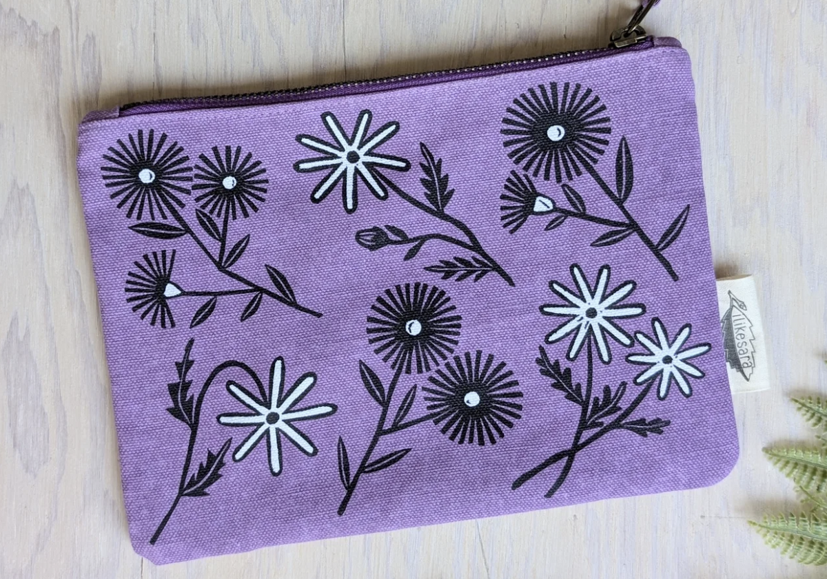 ilikesara zippered pouches shown in a screenshot, featuring colorful fabric designs and secure zipper closures.