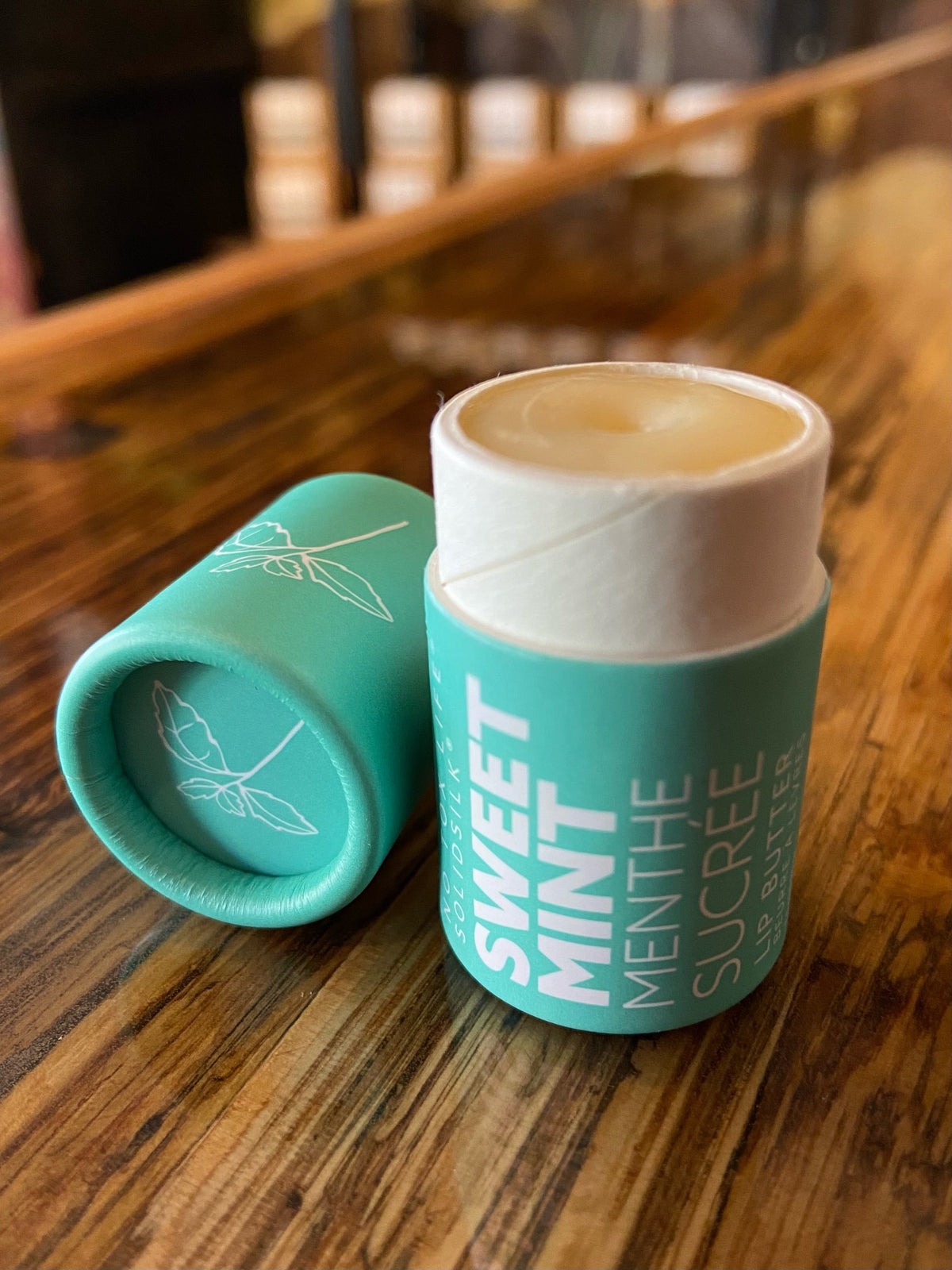 No Tox Life Sweet Mint vegan lip balm with smooth, moisturizing texture and minty scent in a compact container.