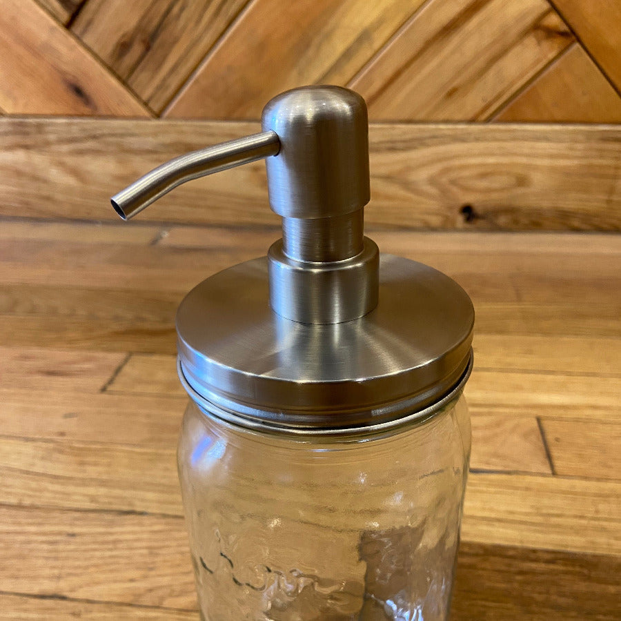 Wide mouth Mason jar pump adapter by One Dream Design, showing the black plastic pump attachment on a glass jar.