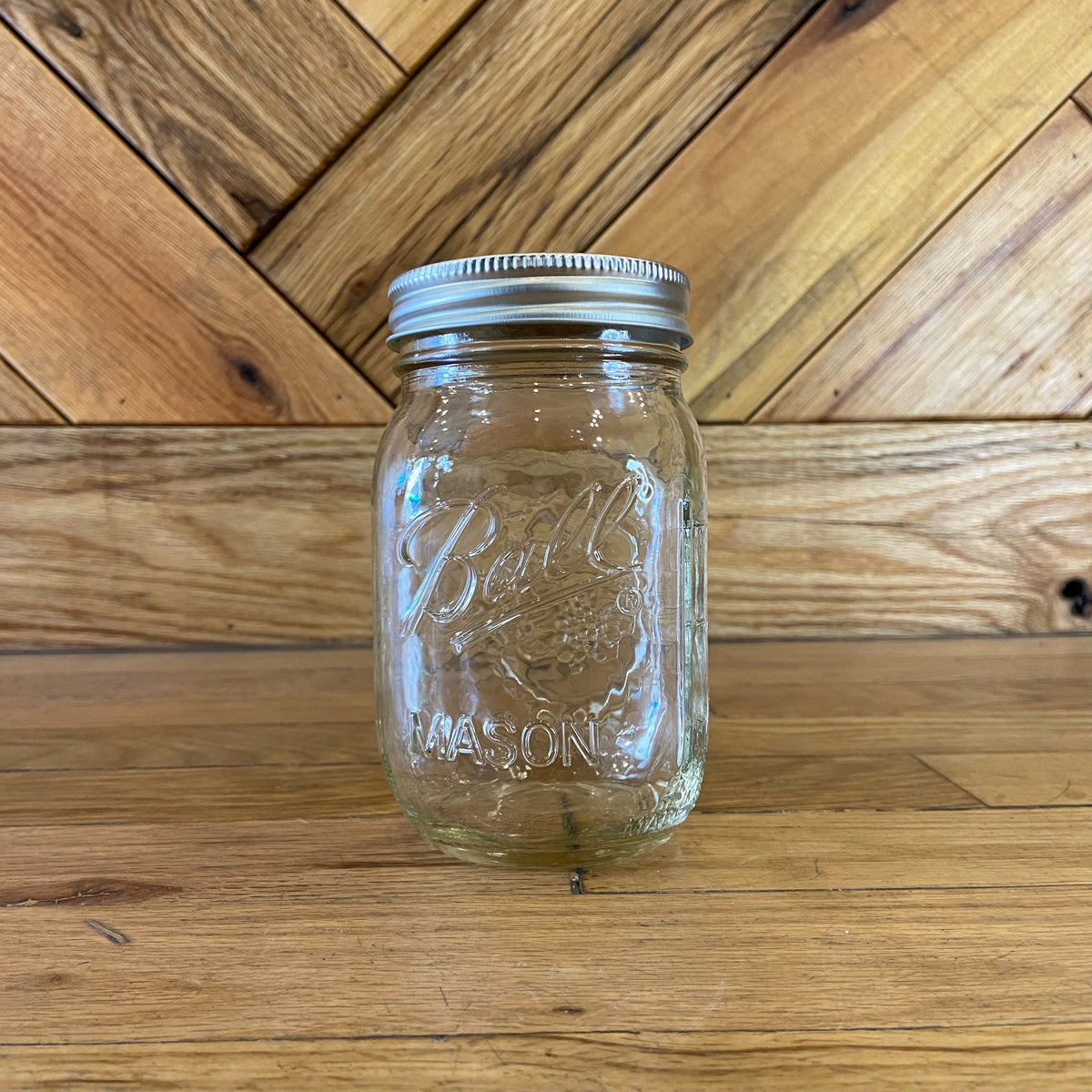 16oz Ball Mason glass jar with screw-top lid, ideal for canning, storage, and preserving food.