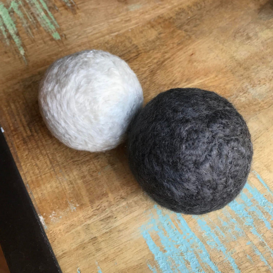 Vegan bamboo dryer balls by Dragonfly, natural eco-friendly laundry solution, with smooth, round bamboo balls for softening clothes.