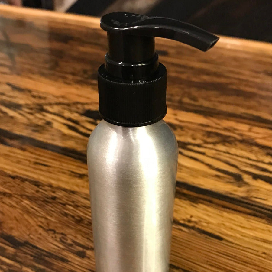 Aluminum bottles with lotion, soap, and fine mist spray pumps from OTB Refills, shown with various pump caps and labels.