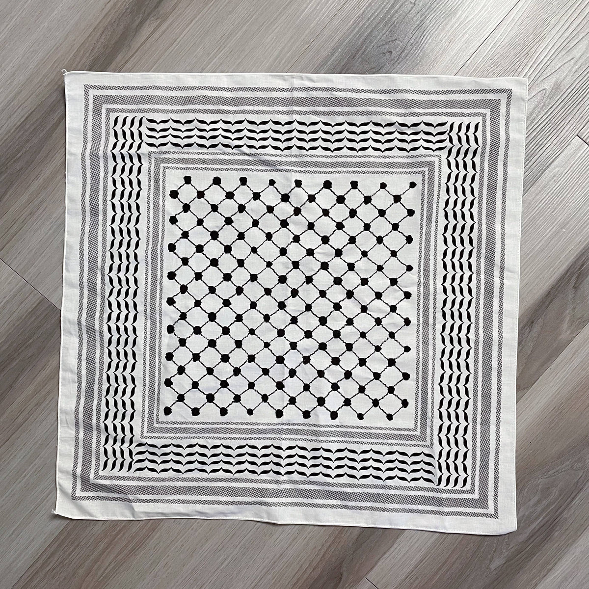 Stitch4pali 100% cotton keffiyeh bandana with traditional black and white geometric pattern, displayed flat on a white background.