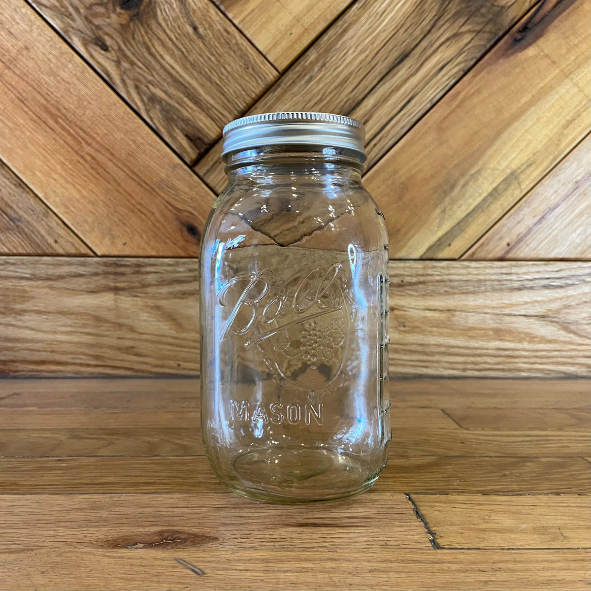 32oz Ball Mason glass jars with metal lids, ideal for canning, storage, and preserving homemade foods.