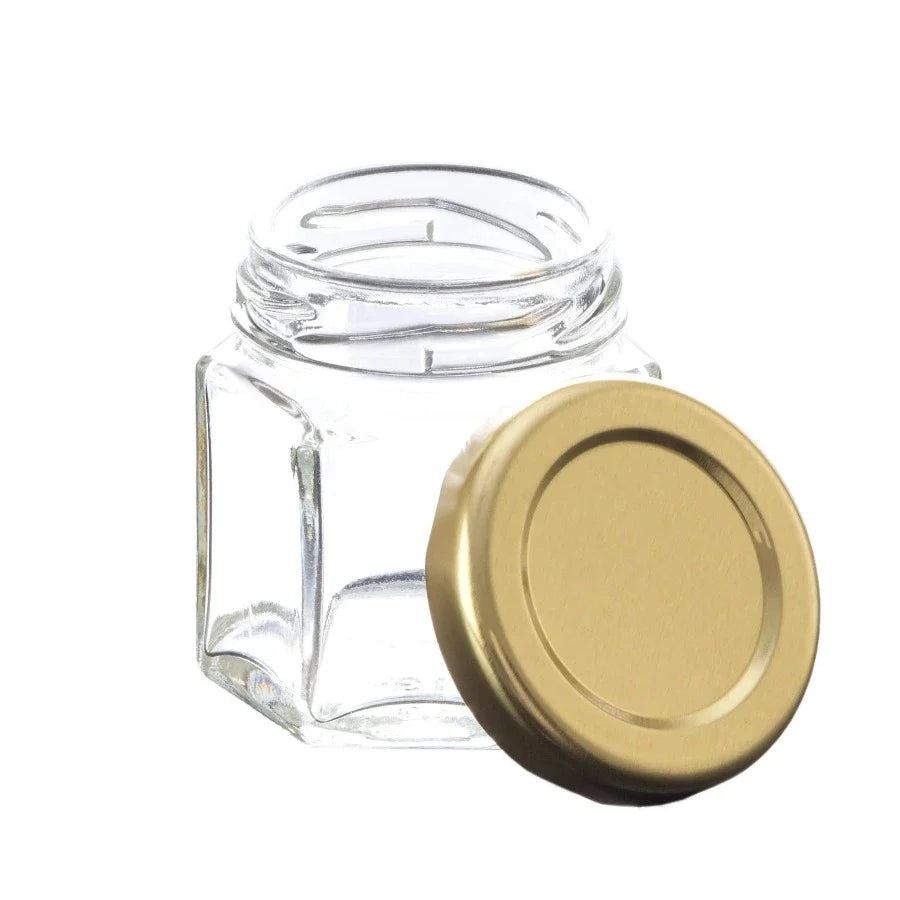 Nakpunar 45ml hexagon glass jar with gold lid, showcasing a stylish storage container with geometric design and metallic accents.