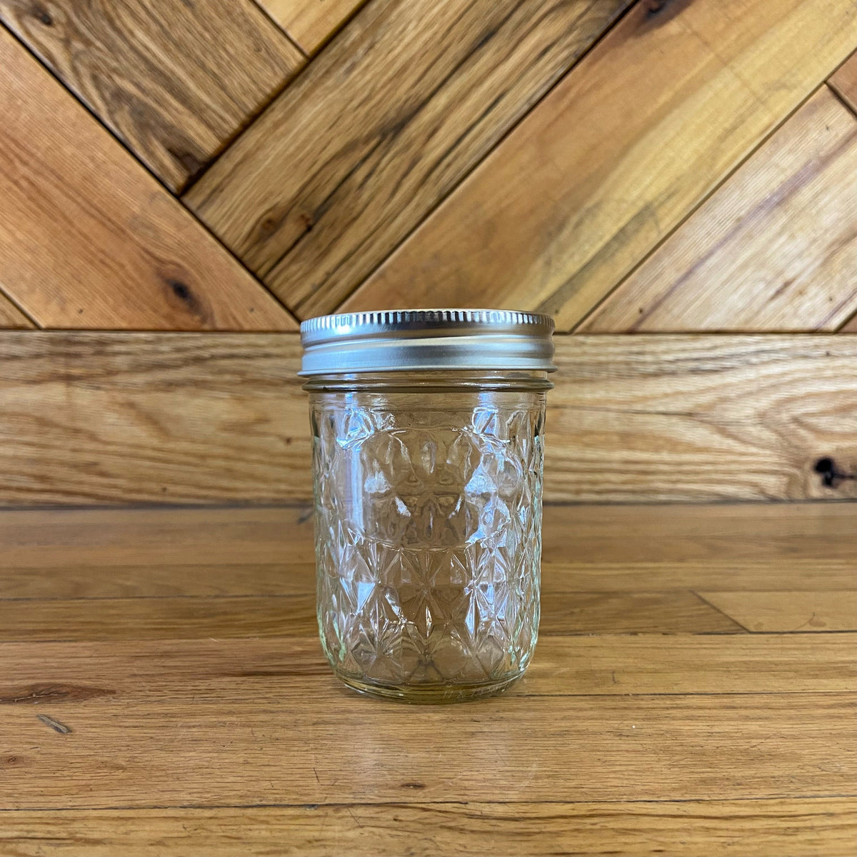 8oz Ball Quilted Ball Mason Jar made of glass with a quilted pattern, ideal for storage and canning.