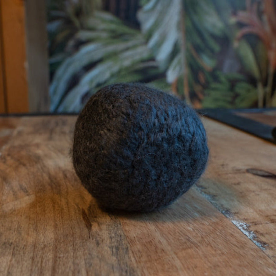 Vegan bamboo dryer ball from Dragonfly with charcoal, softening laundry naturally and reducing static in the dryer.