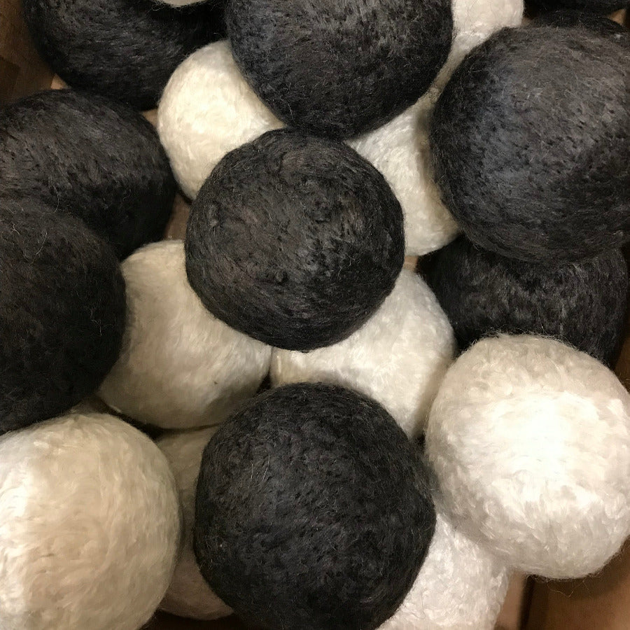 Vegan bamboo dryer balls from Dragonfly, natural eco-friendly laundry accessory, shown in a close-up image.