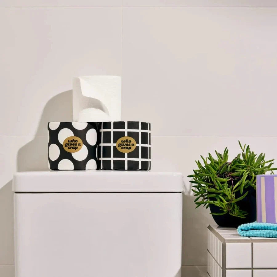 Bamboo toilet paper roll with 370 sheets, eco-friendly biodegradable bathroom tissue from Who Gives a Crap, showing multiple sheets on the roll