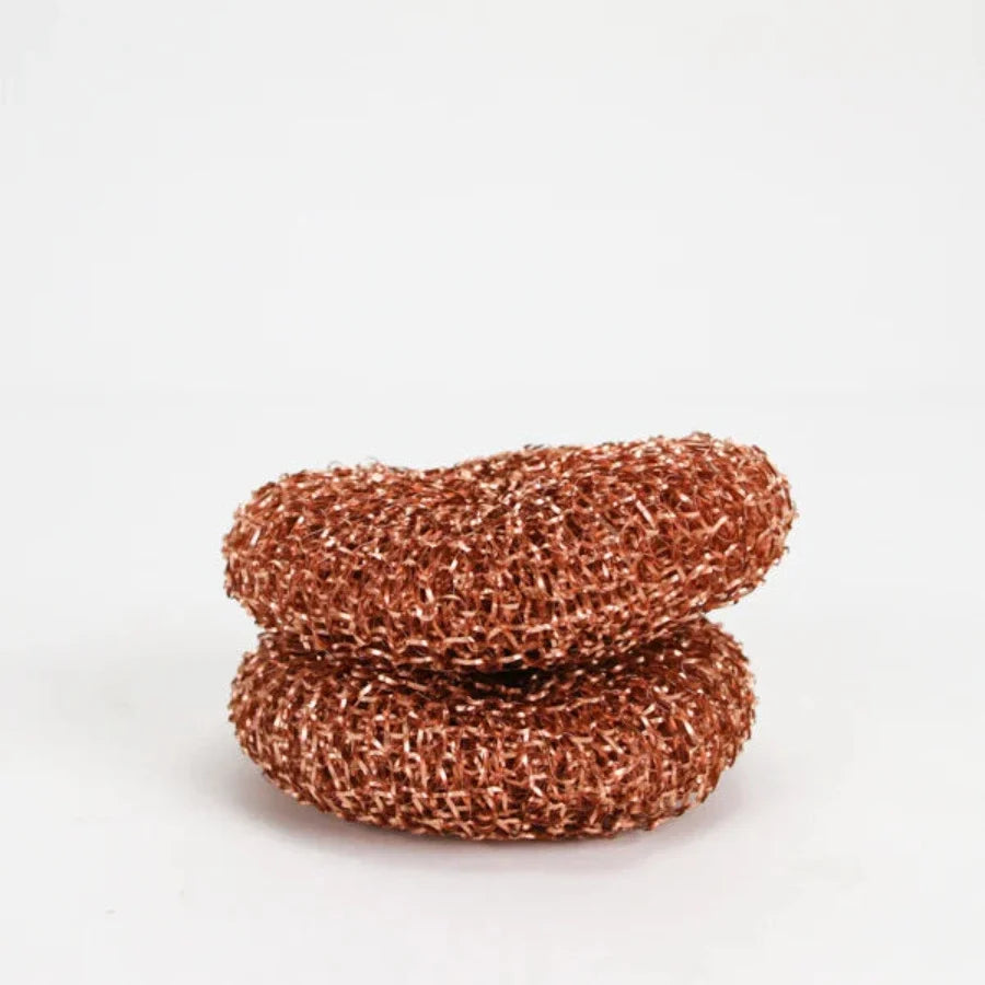 White copper scrubber scouring pad from OTB Refills for cleaning pots, pans, and cookware with durable copper bristles.