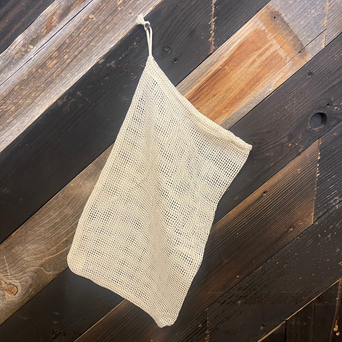 Cotton mesh bag in various sizes by OTB Refills, showing breathable fabric and sturdy handles for eco-friendly storage and organization.