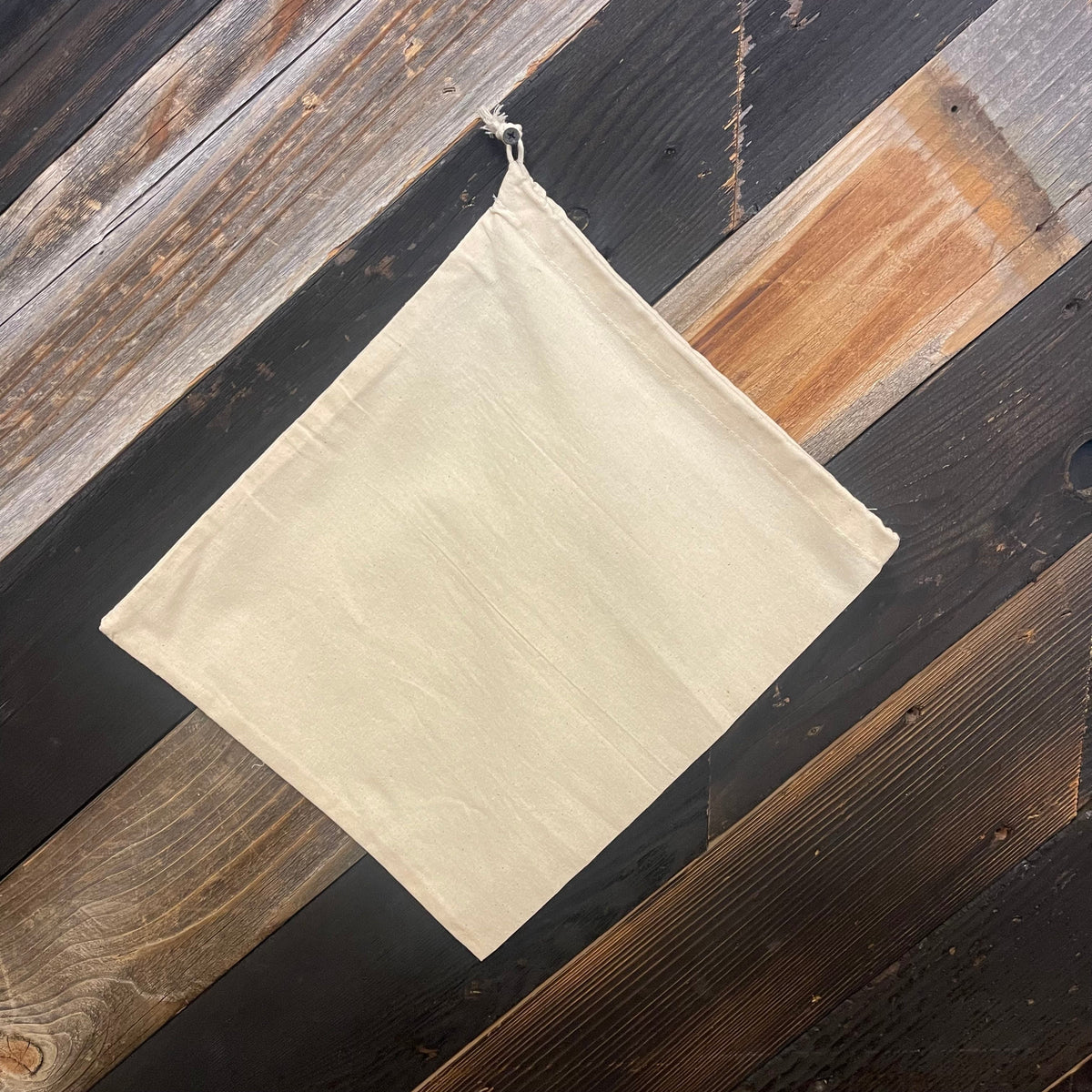 Cotton drawstring bag by OTB Refills, available in all sizes, showing a natural cotton fabric with drawstring closure.