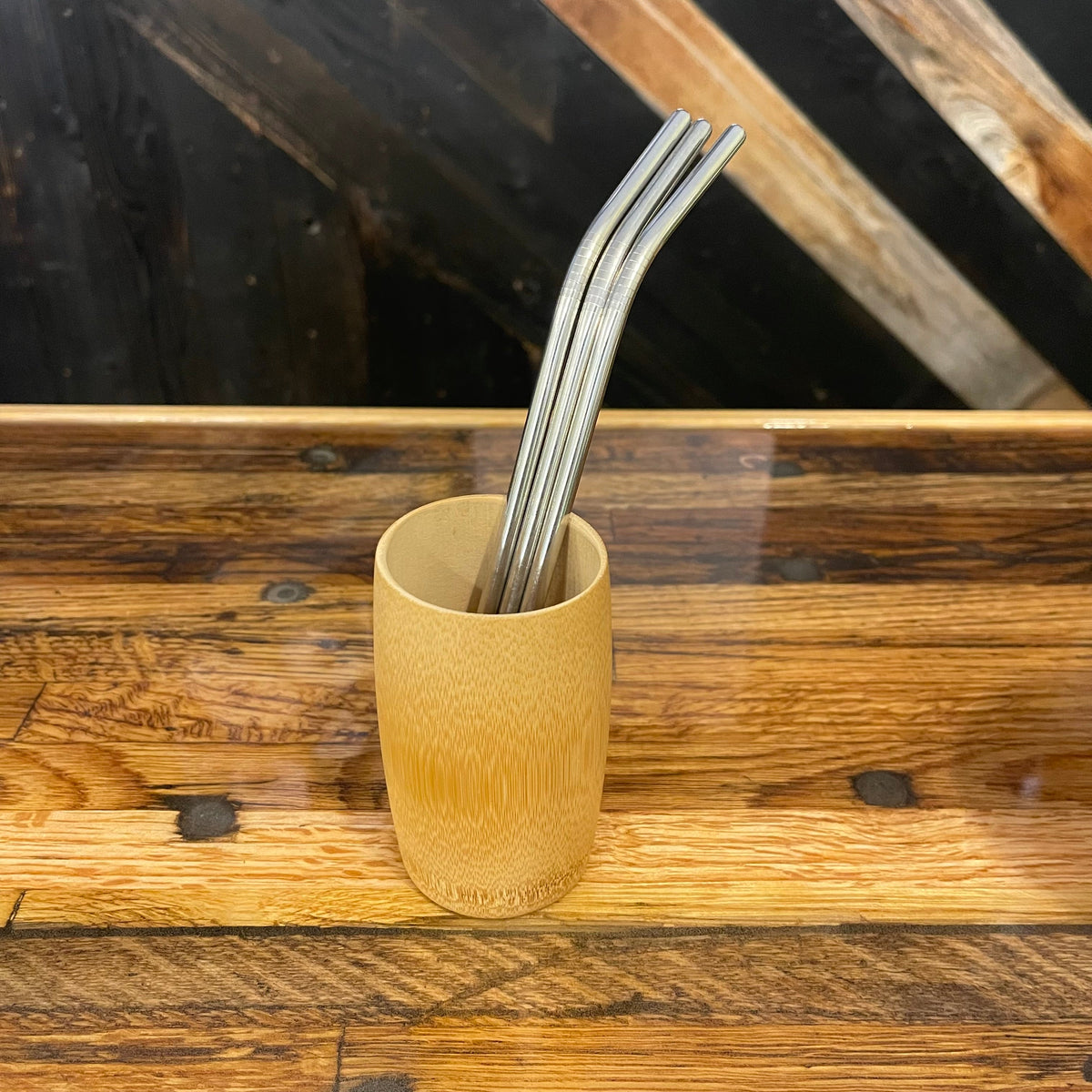 Assorted bent stainless steel straws by OTB Refills, eco-friendly reusable drinking straws on a white background.