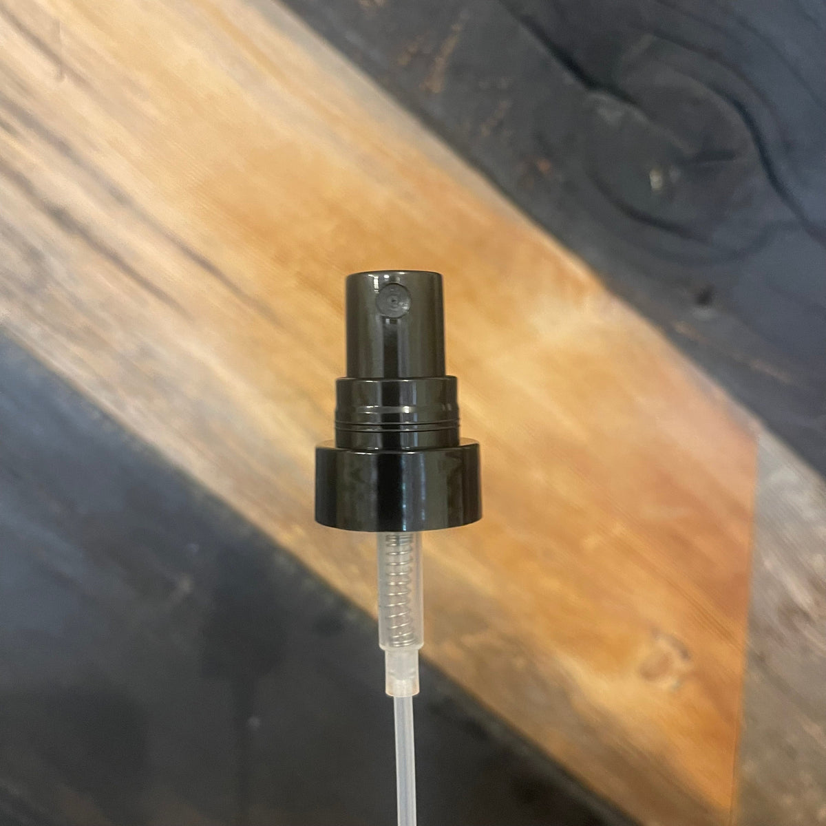 Premium Vials Fine Mist Sprayer showing a clear plastic bottle with a white spray nozzle for even misting.