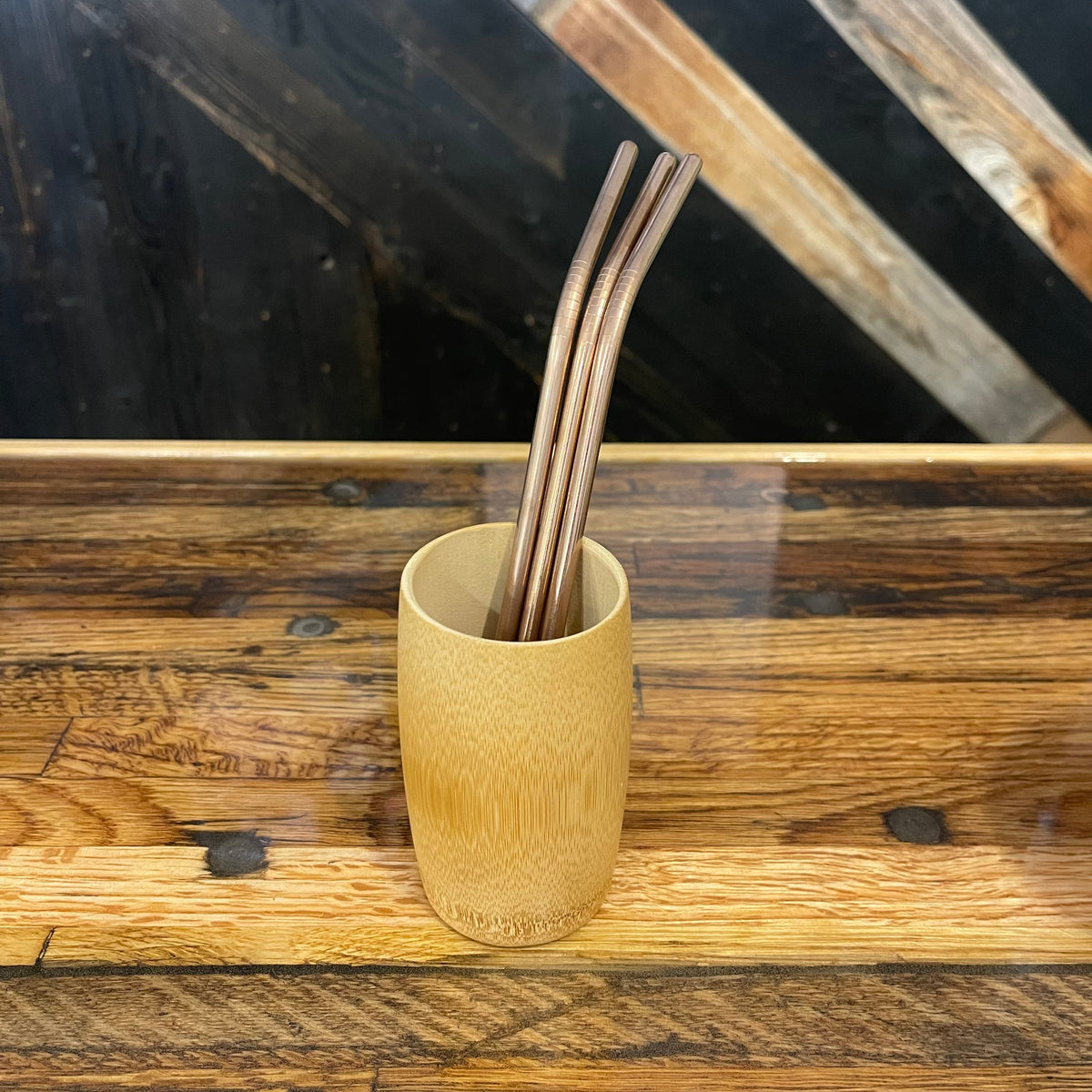 Assorted bent stainless steel straws from OTB Refills, shiny and reusable, set of multiple colorful bent drinking straws.