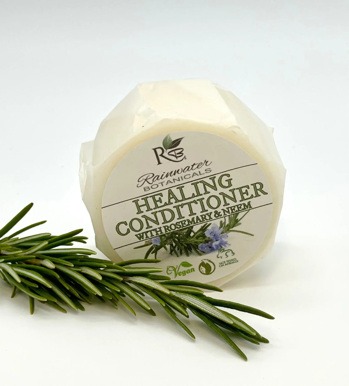 Rainwater Botanicals healing solid conditioner bar, zero waste hair care product with natural ingredients and eco-friendly design.