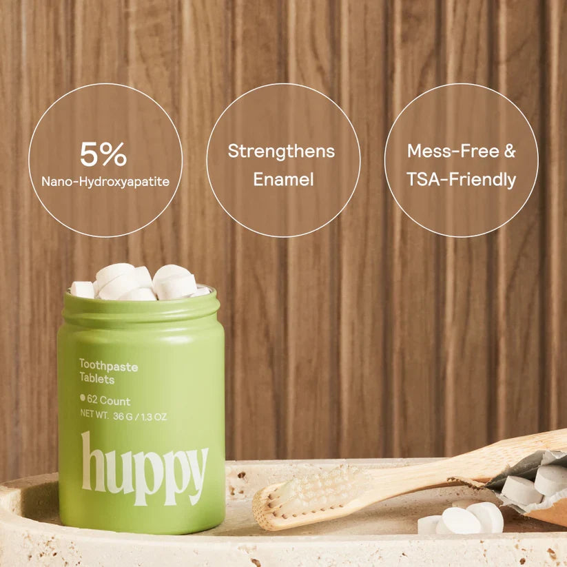 Huppy peppermint toothpaste tablets in a tin, showing 62 chewable tablets for natural oral hygiene and fresh breath.
