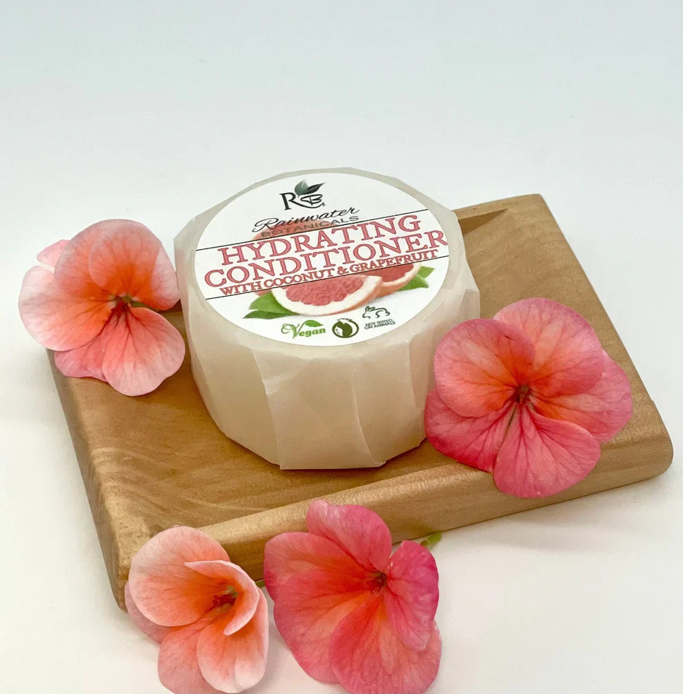 Hydrating Rainwater Botanicals Conditioner Bar in a zero-waste solid form, designed for nourishing hair.