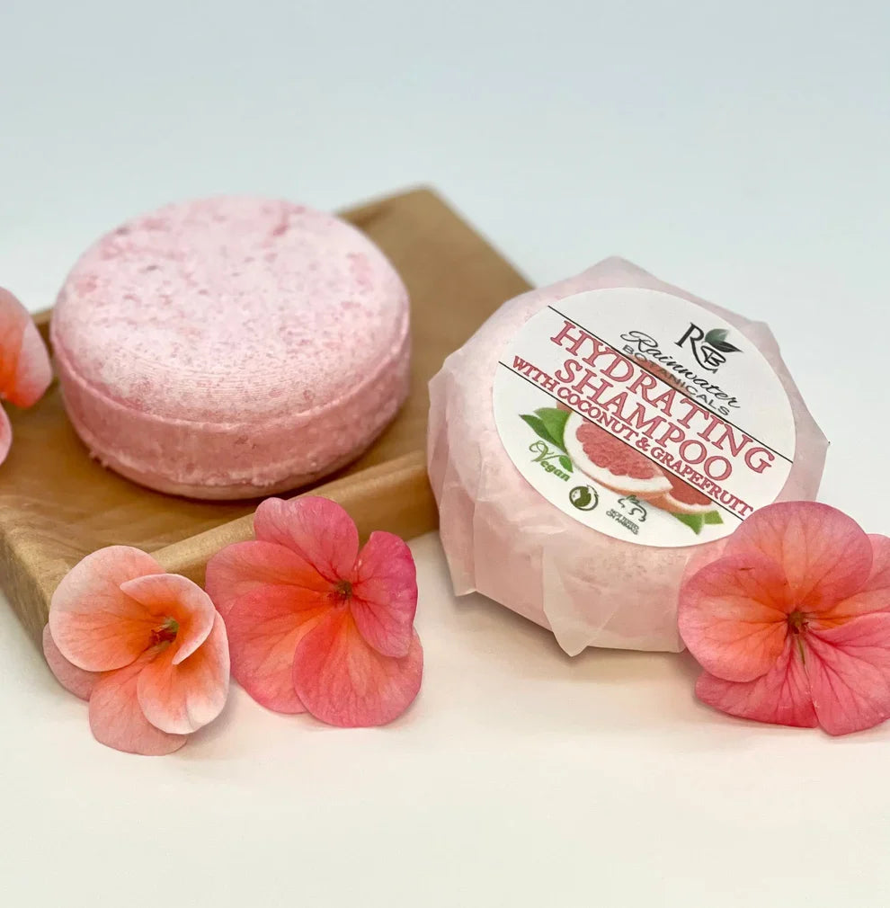 Hydrating Rainwater Botanicals solid shampoo bars with zero waste packaging, designed for gentle, eco-friendly hair cleansing.