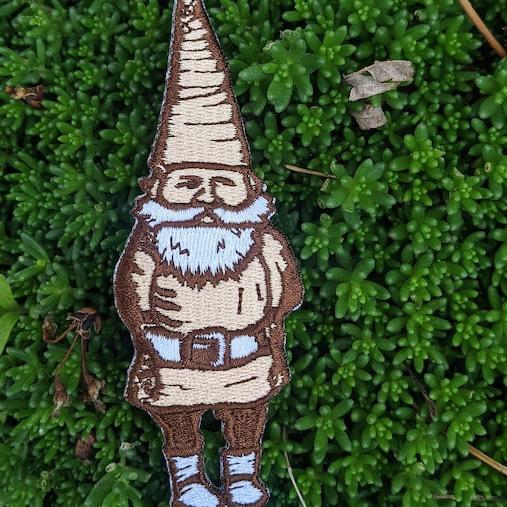 ilikesara patches displayed on a surface, featuring colorful fabric designs and various sizes for decorating clothing or accessories.
