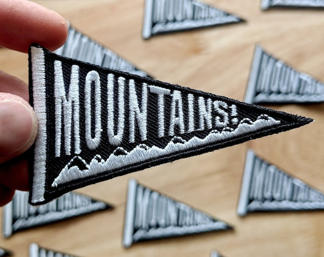 ilikesara patches featuring colorful floral embroidery on fabric, showcasing intricate stitched designs and vibrant details.