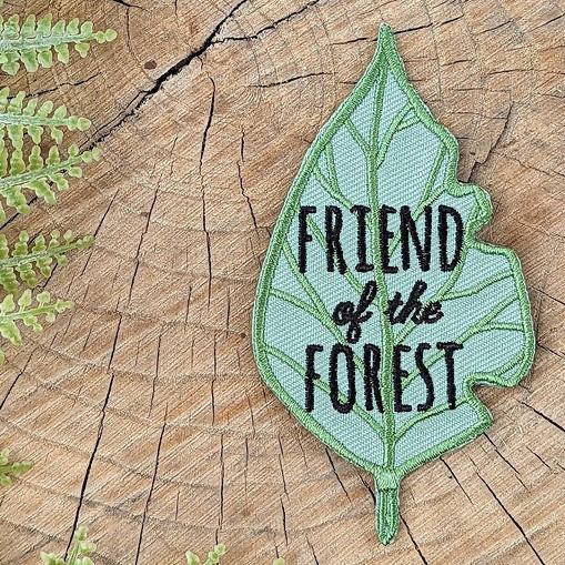 ilikesara patches shown on a surface, colorful fabric embellishments with intricate designs, ideal for clothing decoration.