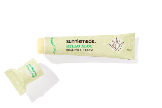 Sunniemade Lip Balm tube with natural ingredients, featuring a sleek design and clear branding on the packaging.