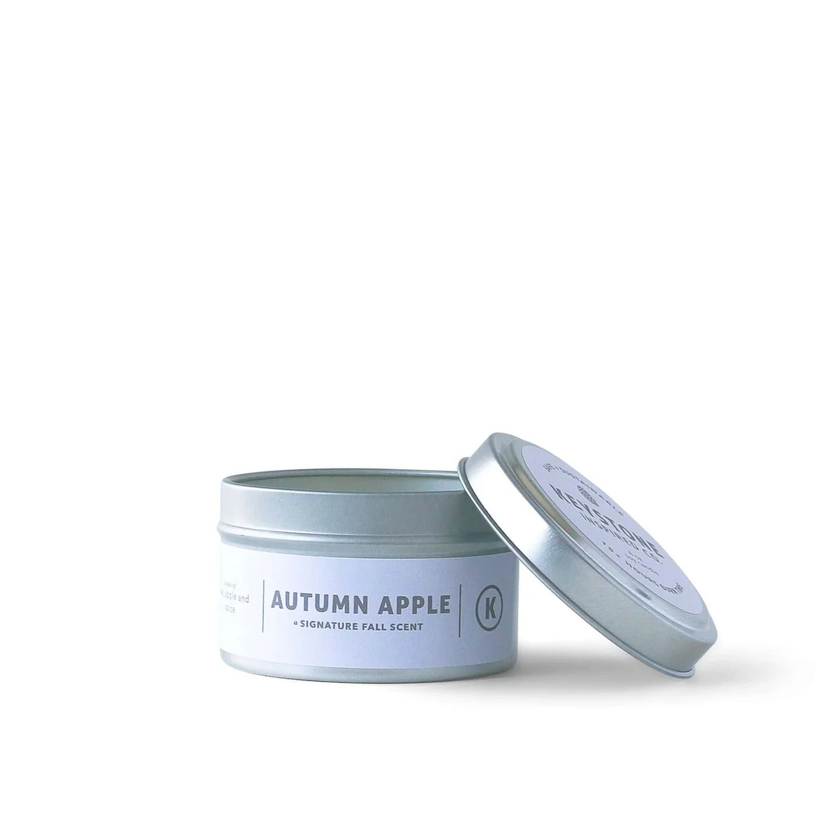 4 oz soy candles in travel tin by Keystone Inspired, showing a cozy candle with a wooden wick and minimalist label.