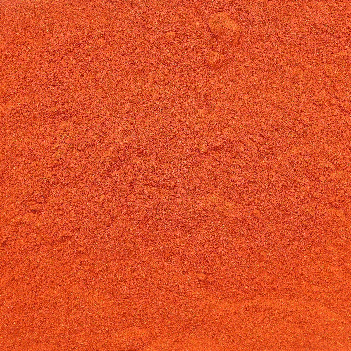 Organic Sweet Paprika from Essential Organics in a glass jar, showing vibrant red spice with a textured surface.