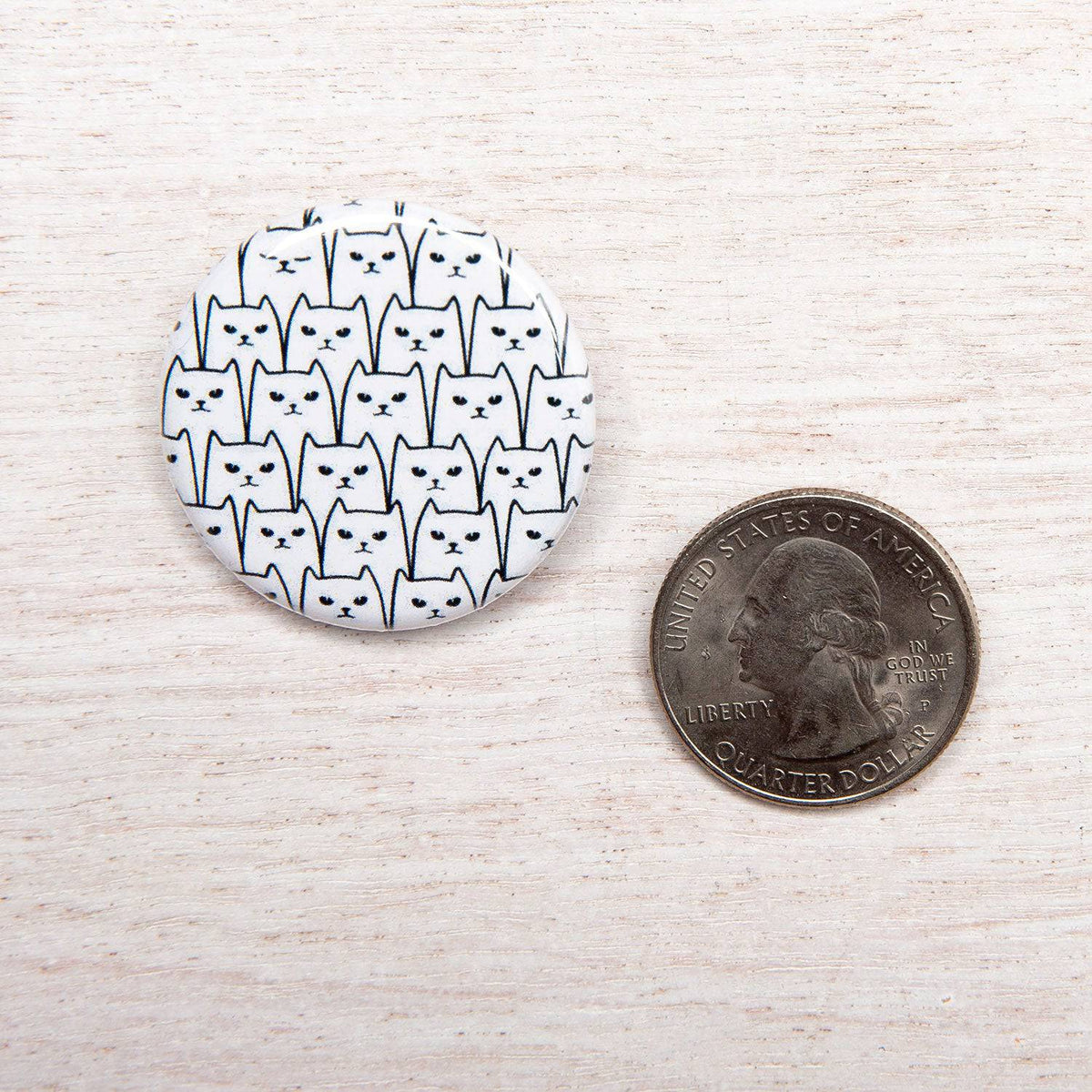 Counter Couture button featuring a stylish, round design with intricate detailing, perfect for sewing or craft projects.