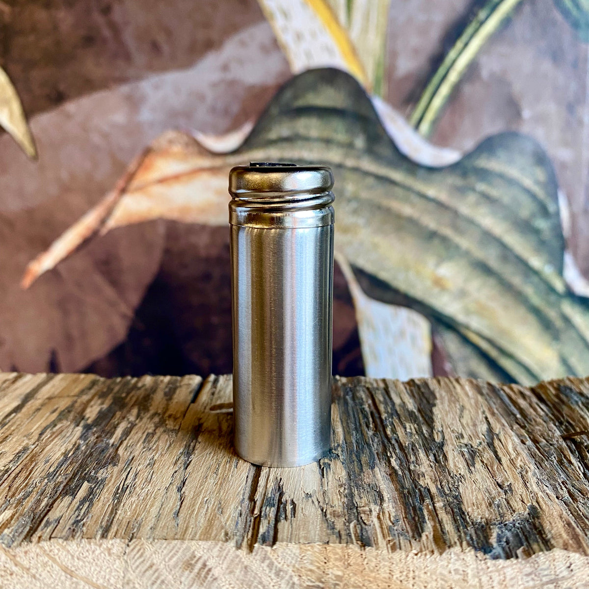 Refillable floss containers by OTB Refills, compact plastic cases with floss spools, designed for easy storage and portability.