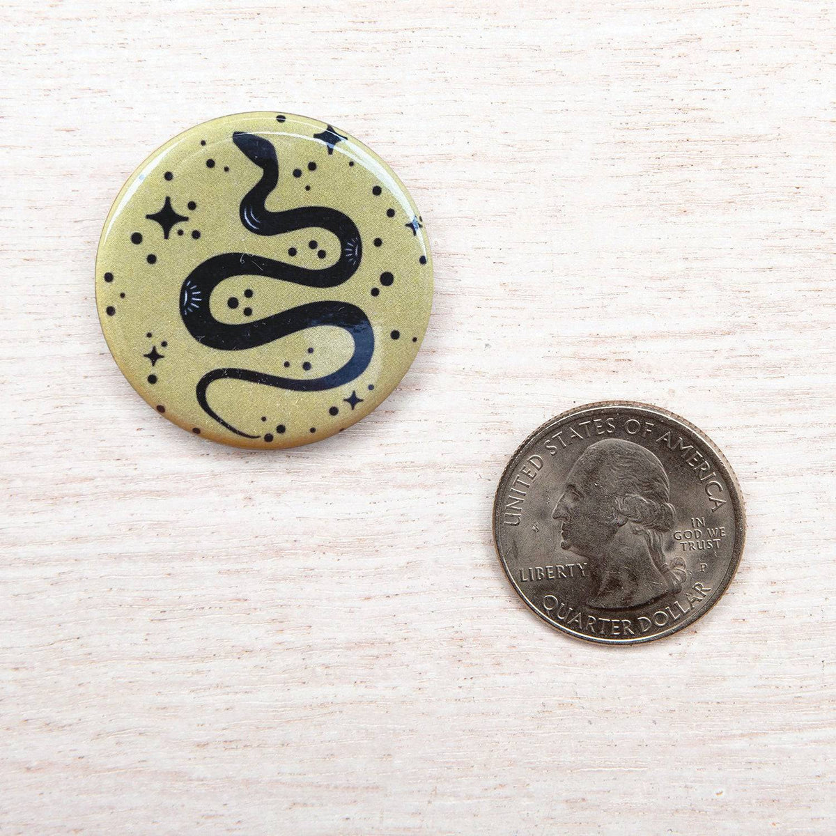 Counter Couture button featuring a stylish design, shown close-up with detailed texture and vibrant color.