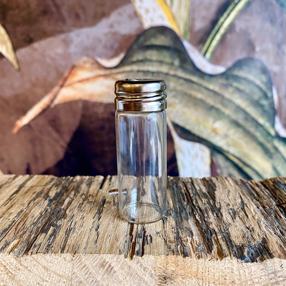 Refillable floss container by OTB Refills with transparent case and white lid, designed for easy storage and portability.