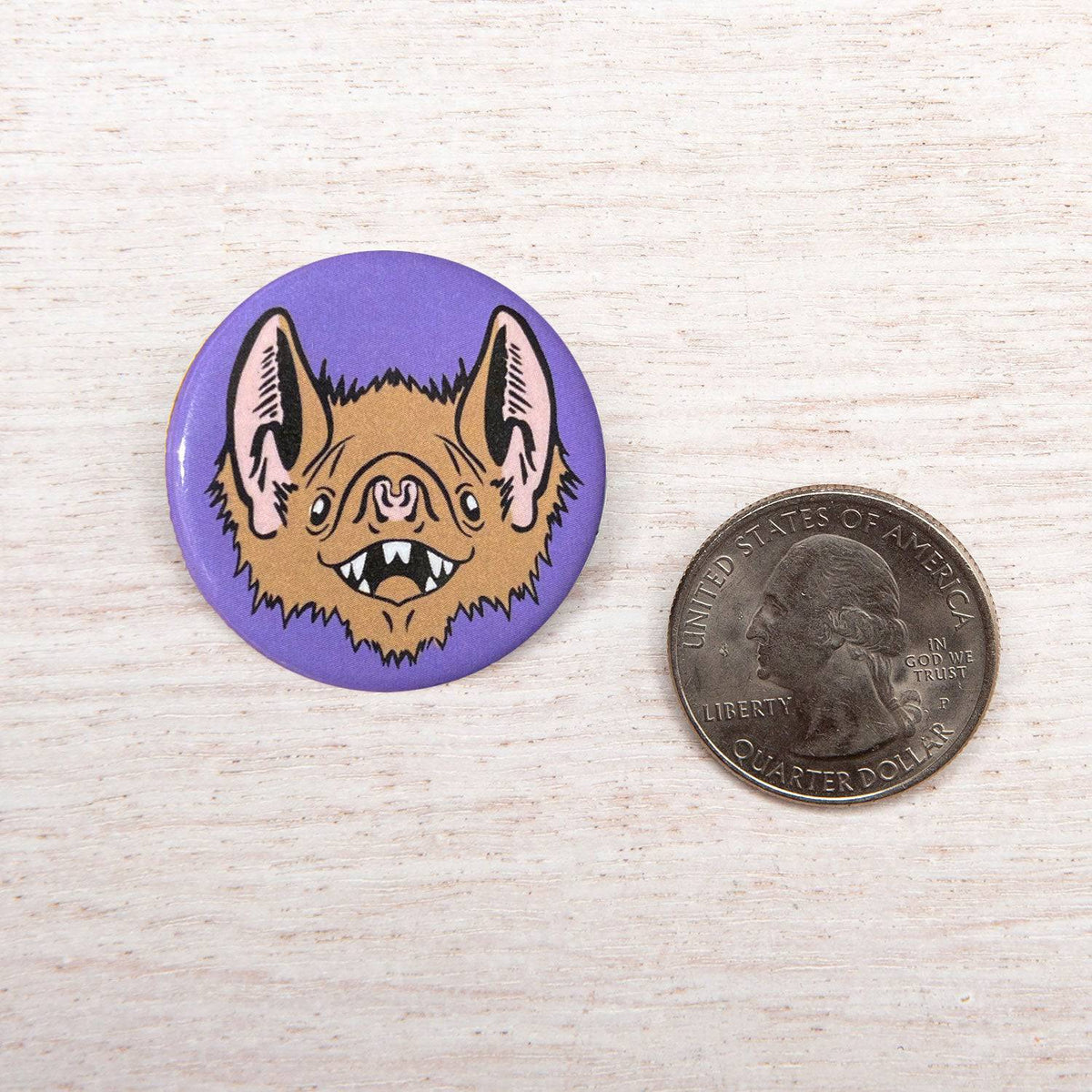 Close-up of a Counter Couture Button, showcasing its detailed design and craftsmanship on a neutral background.