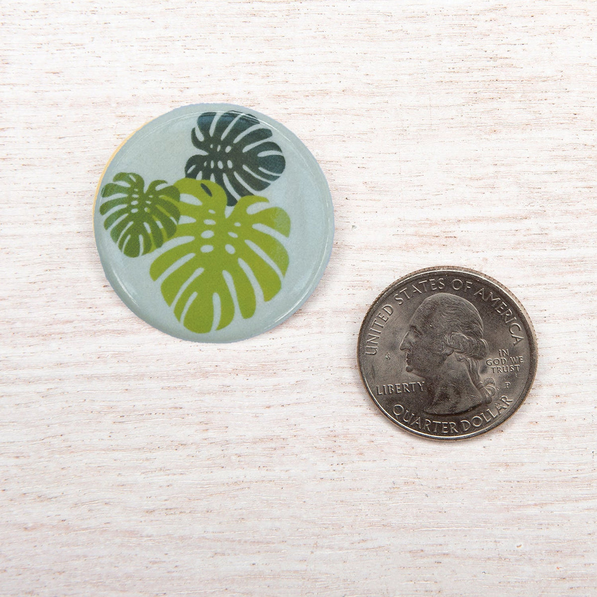 Counter Couture button with decorative design, showcasing intricate details and craftsmanship on a neutral background.