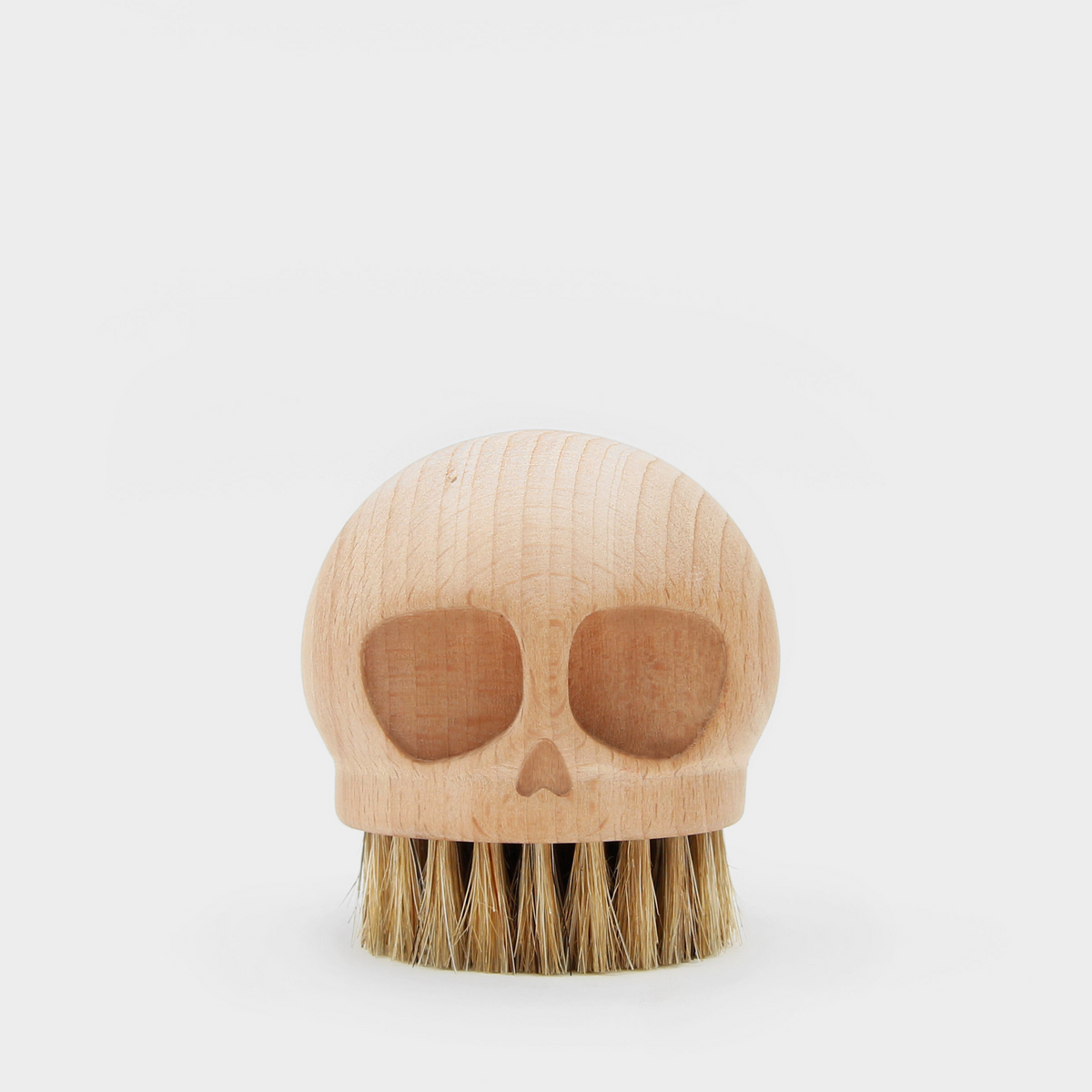 Suck UK Skull Beech Brush with a skull-shaped wooden handle and natural bristles for cleaning or decorative use.