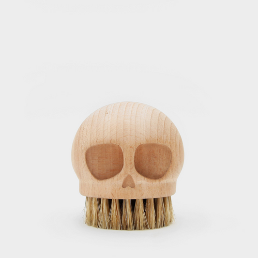 Suck UK Skull Beech Brush with a skull-shaped wooden handle and natural bristles for cleaning or decorative use.