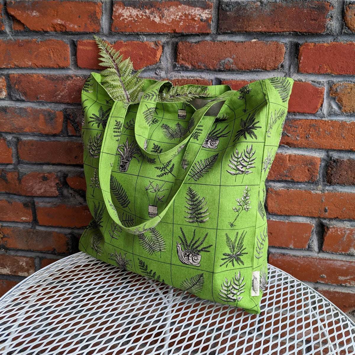 ilikesara tote bag with sturdy fabric and leather handles, featuring a minimalist design and spacious interior for everyday use