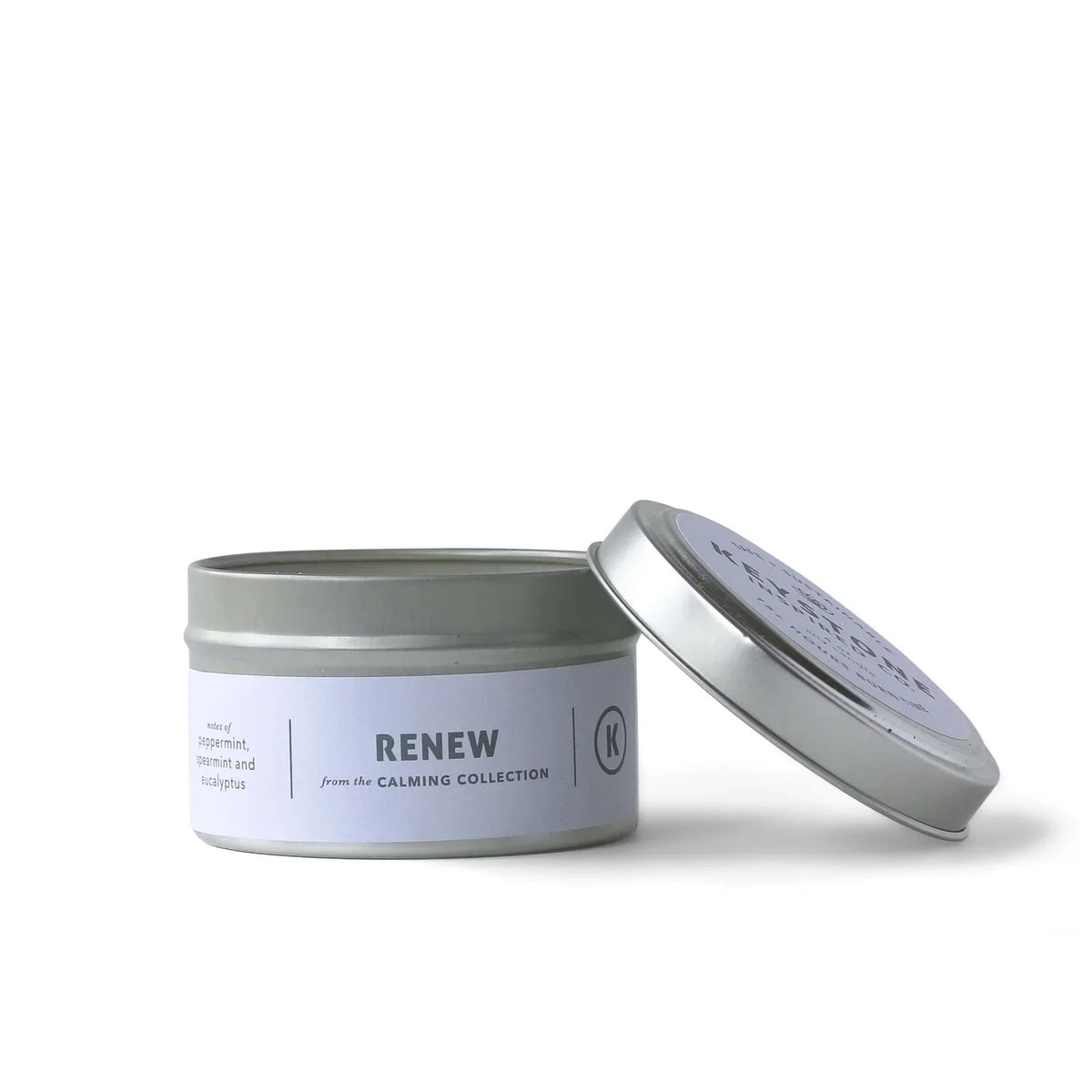 4 oz soy candles in travel tin by Keystone Inspired, showcasing a cozy, reusable candle container with a lit wick.