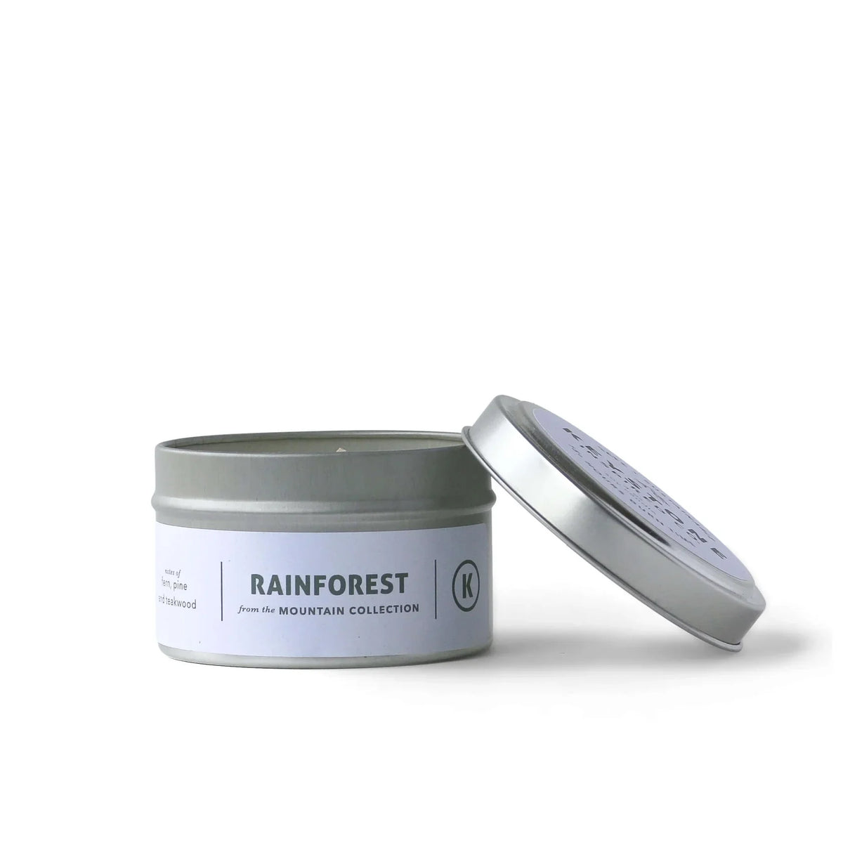 4 oz Keystone Inspired soy candle in a travel tin with a lit wick, showcasing a cozy, warm glow.