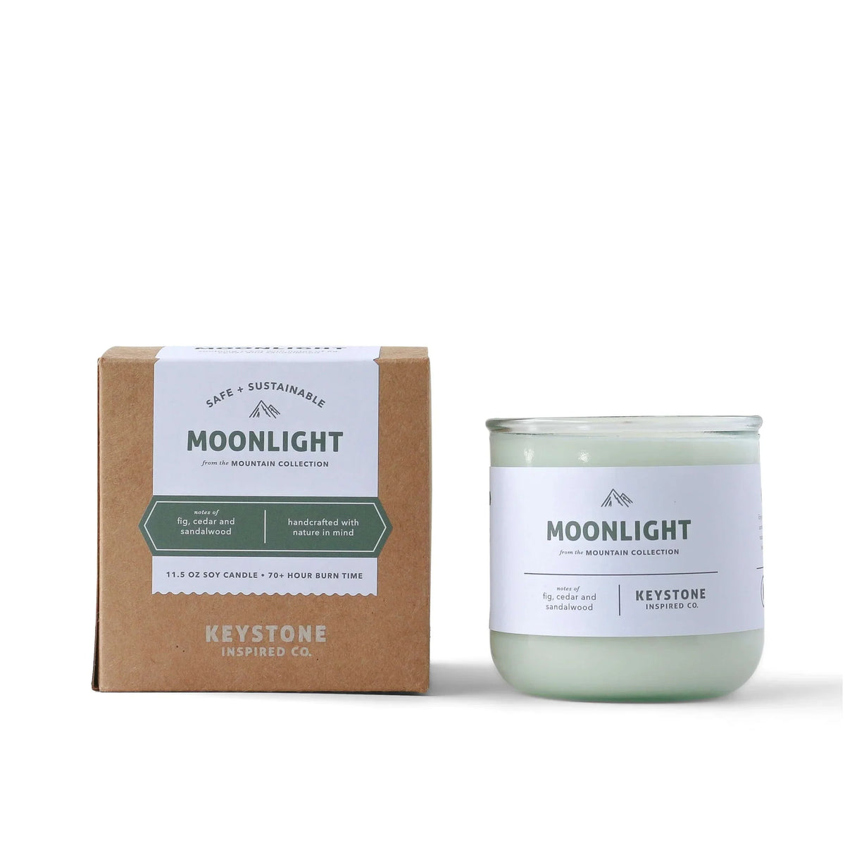 11.5 oz soy candle in a glass jar by Keystone Inspired, with a lit wick and a warm, inviting glow.