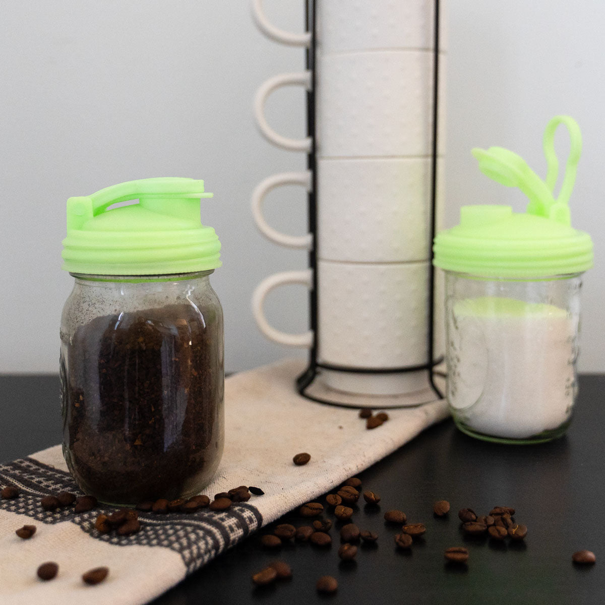 ReCap Mason jar pour spout lid with a metal spout and screw-on design for easy pouring and sealing.